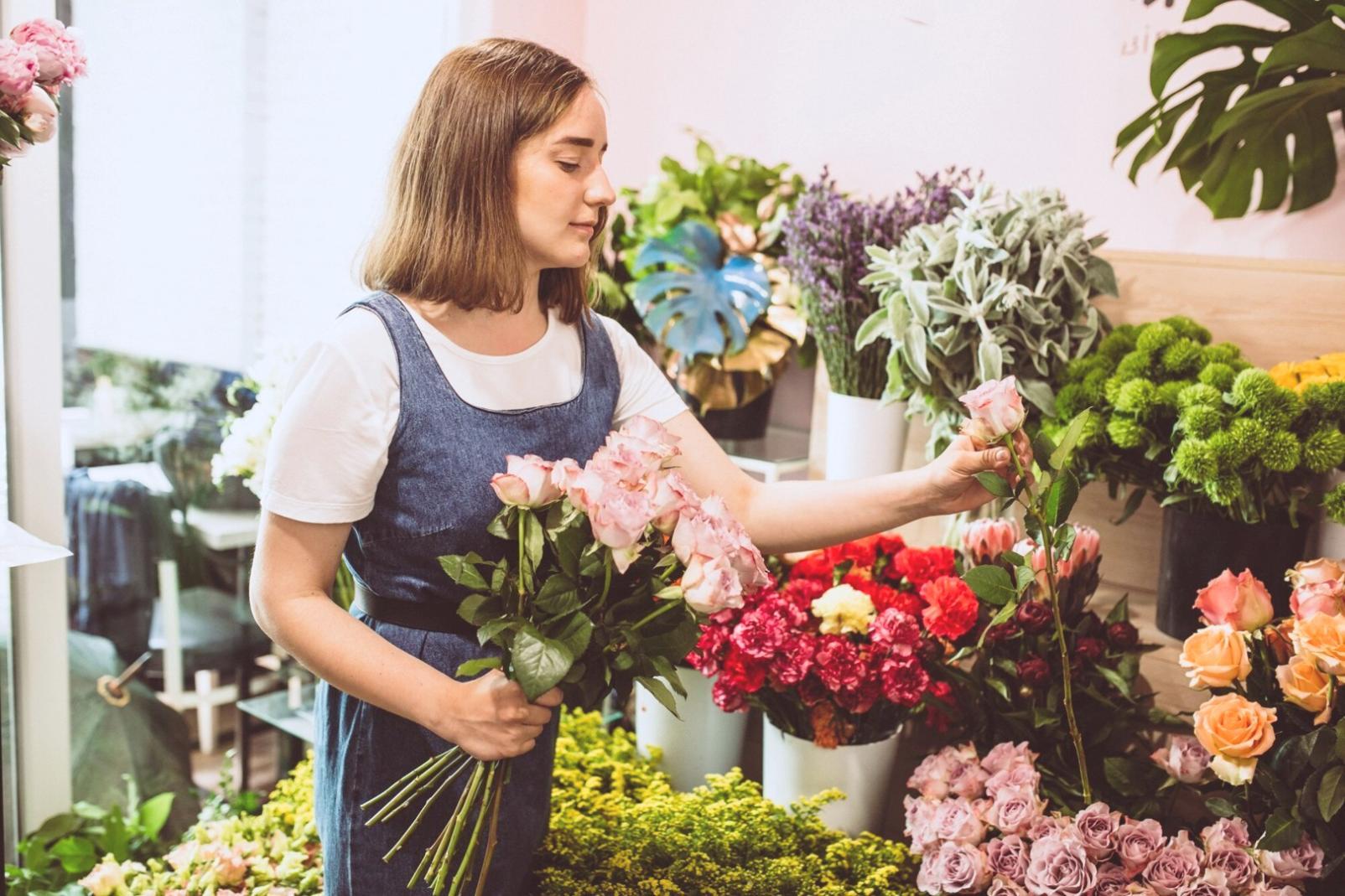Dried flower preservation process showing careful handling and natural color retention