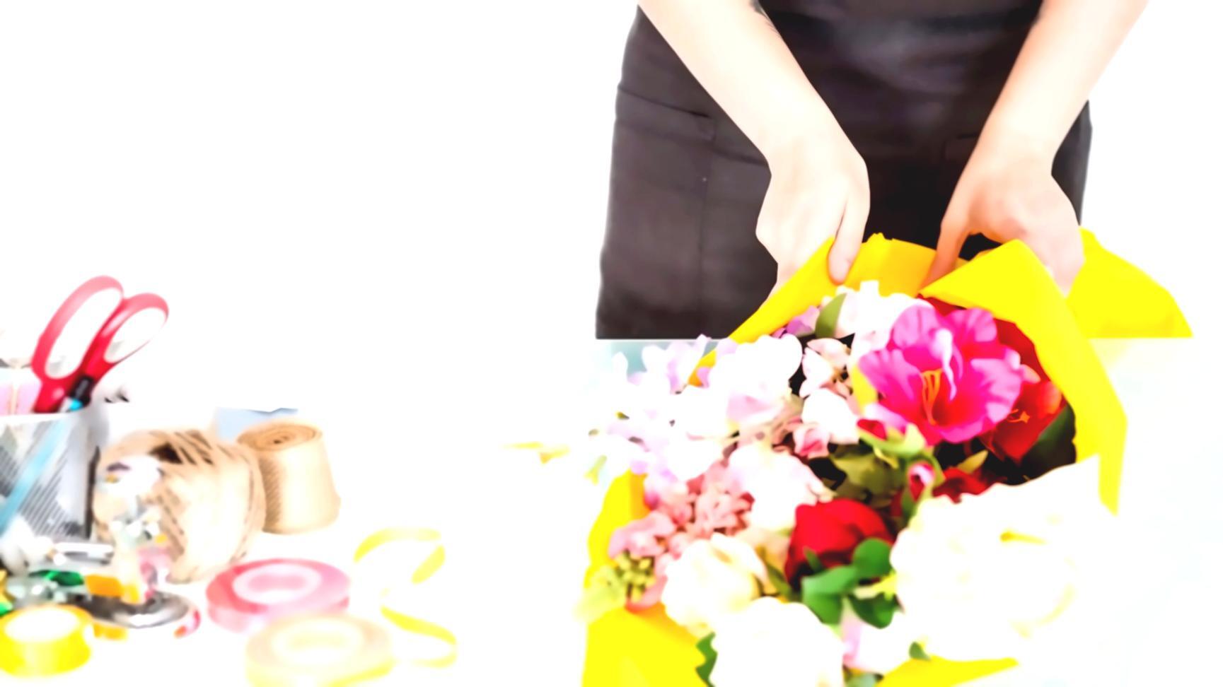 Student working on arrangement composition during hands-on practice session